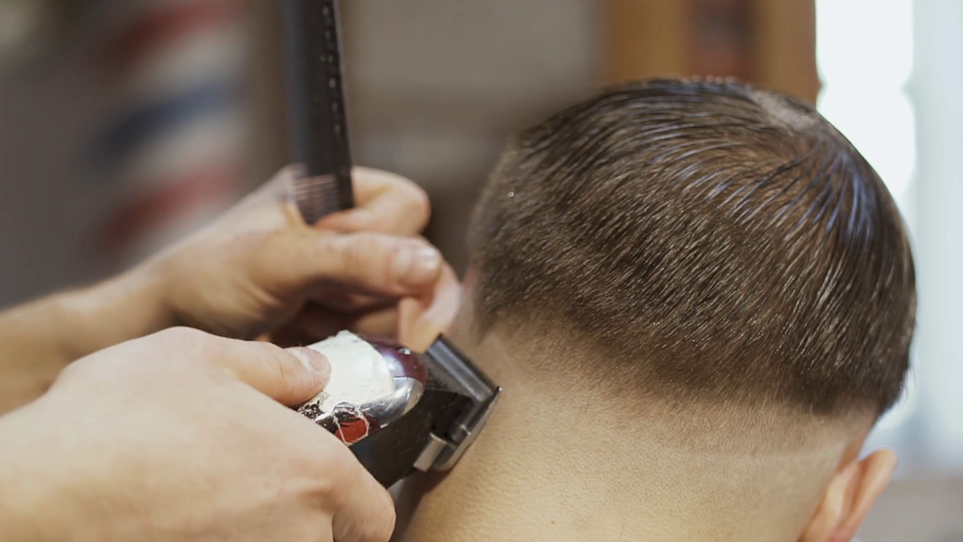 Barber Cuts Hair With Electric Razor Stock Footage SBV322533061