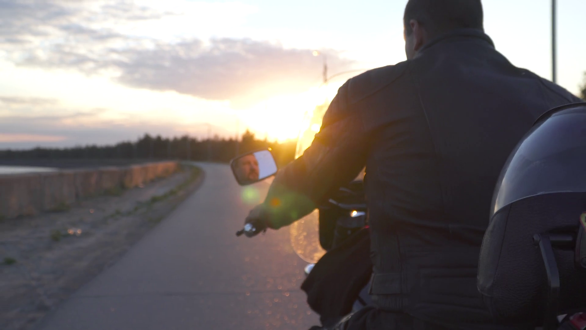 Biker On Motorcycle Riding On Road At Sunset Stock Footage SBV ...