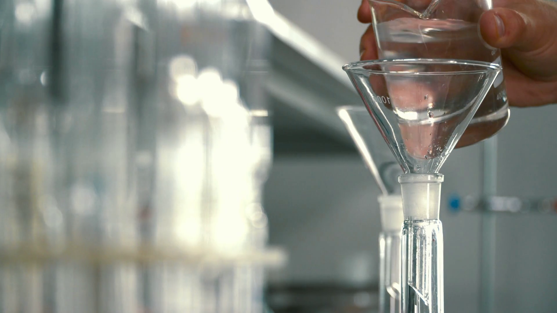 Chemist Pouring Alcohol Into Flask Through Stock Footage SBV324449999