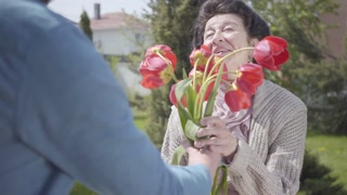 Grandson's Heartwarming Visit: Tulip Bouquet, Hugs, Smiles, Birthday Celebration