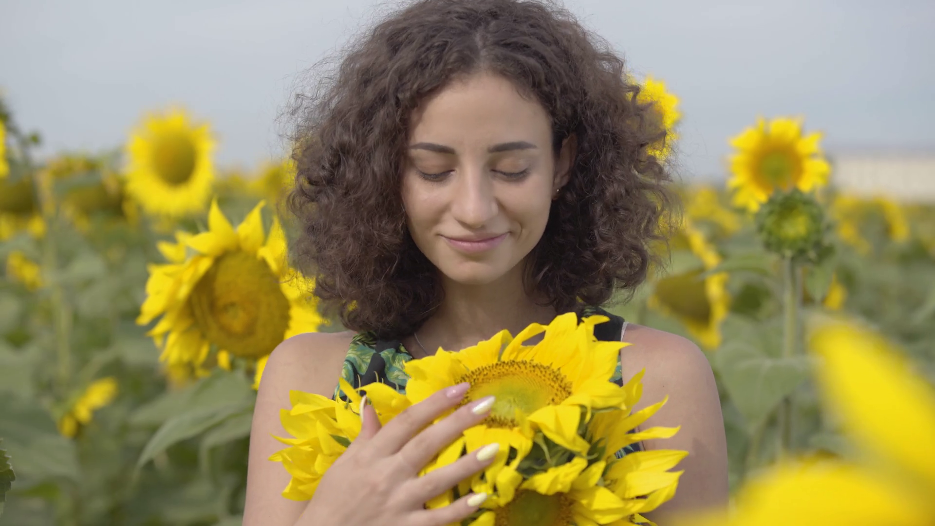 Portrait Of Adorable Curly Playful Girl Looking At The Camera