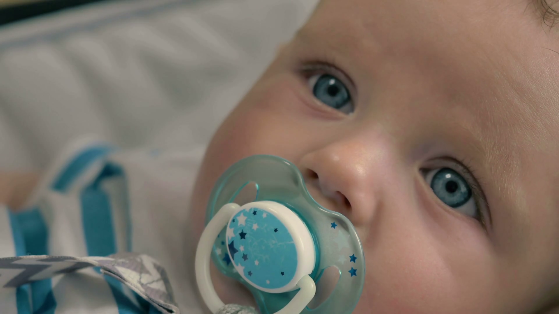 Portrait Of Cute Baby With Dummy Is Crying Stock Footage SBV316638389