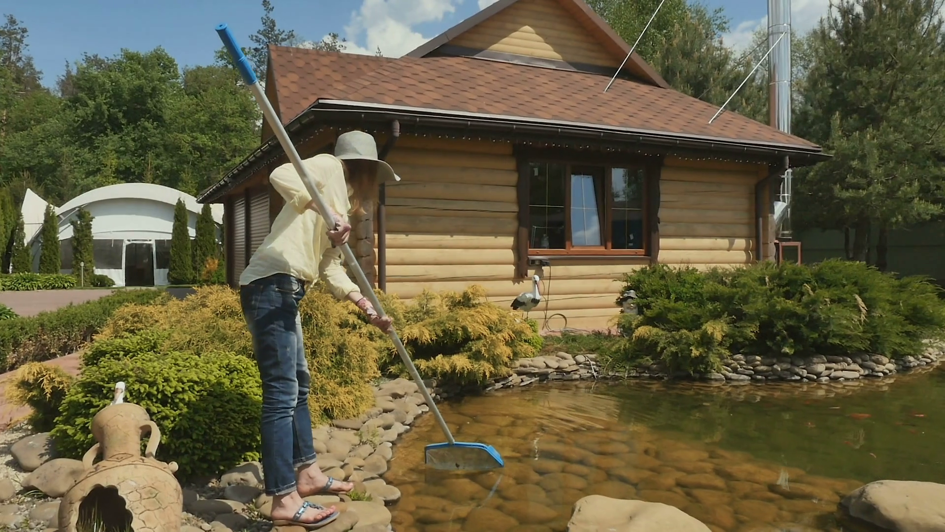 The Woman Catches Insects In Pond With Nettle Stock Footage SBV ...