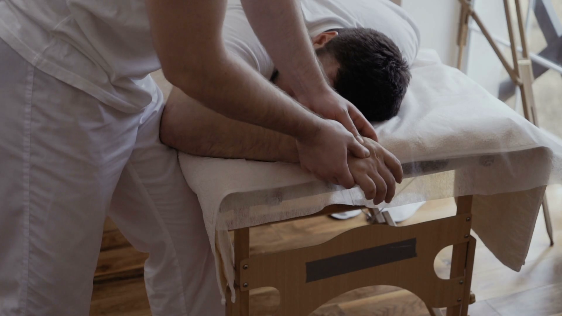 Therapist Massages Hand Of Young Man Stock Footage SBV320124267