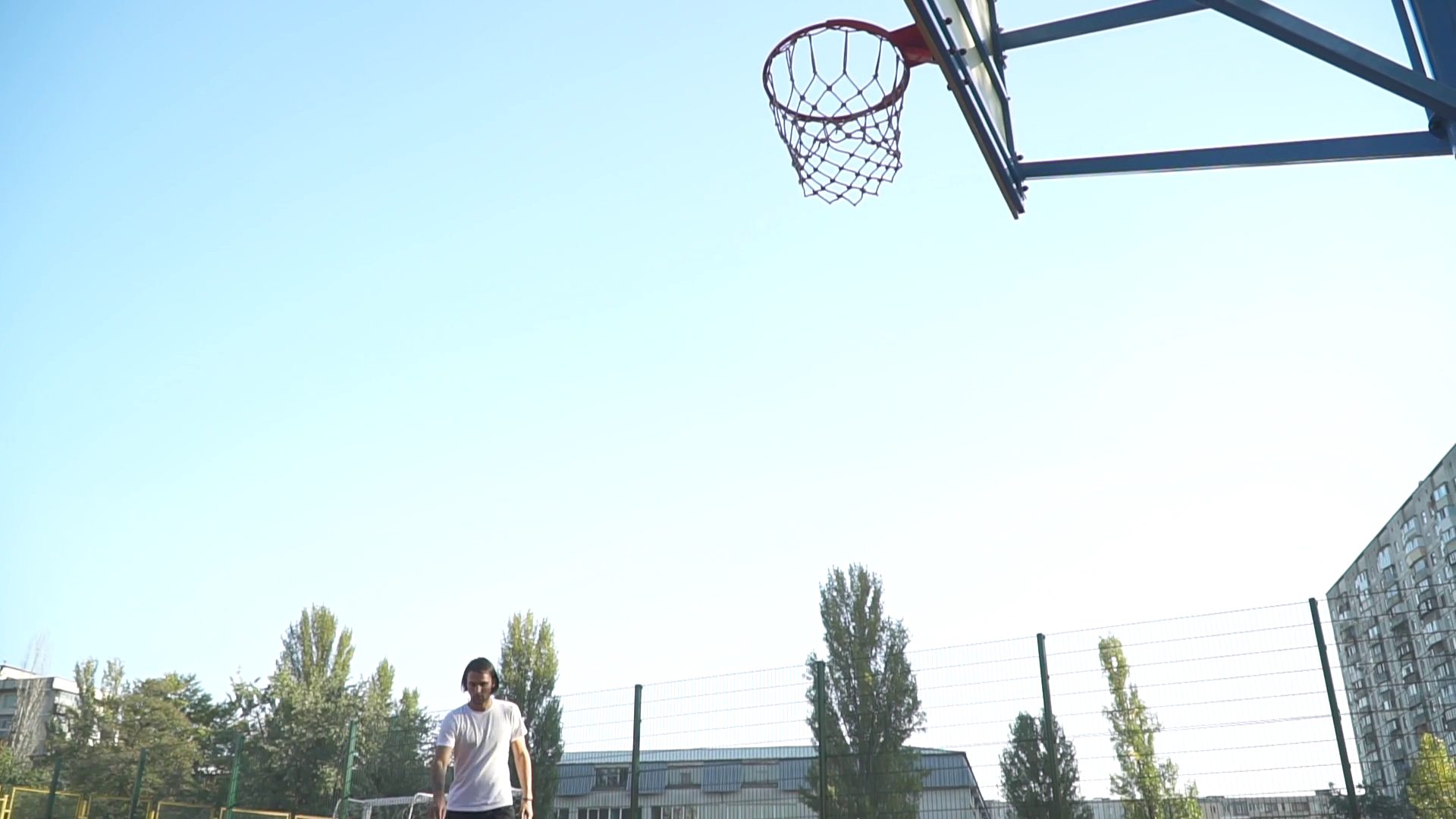 Young Guy Throws Basketball Into Basketball Stock Footage SBV328953570