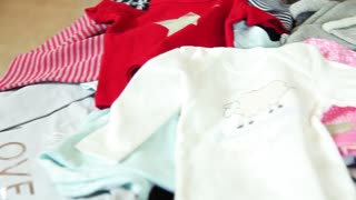 Lviv \ Ukraine - July 7 2018: Colored clothes for children. Girls dresses. Indoors. Fashion concept. Shop, room, set, shelf, style, textile, variety, wardrobe