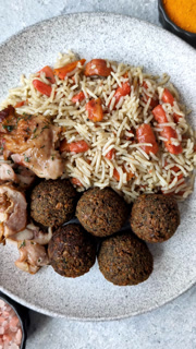 Kabsa or mandi, an Arabic dish with rice and chicken, salt, and spices. Kabsa or mandi
