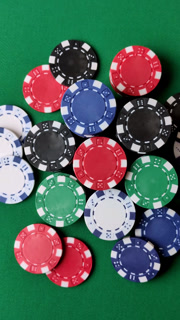 Multicolored casino chips as a conceptual backdrop for gambling games. Multicolored casino chips
