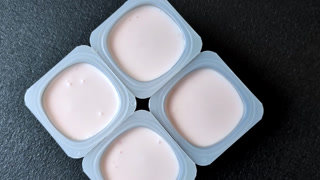 Milky liquid drinking yogurt, a useful food for healthy digestion. Drinking yogurt