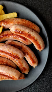 Grilled or barbecued chicken sausages for the dinner table. Grilled sausages
