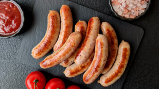 Grilled or barbecued chicken sausages for the dinner table. Grilled sausages