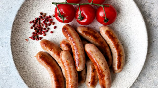 Grilled or barbecued chicken sausages for the dinner table. Grilled sausages