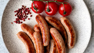 Grilled or barbecued chicken sausages for the dinner table. Grilled sausages