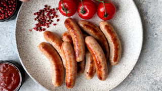 Grilled or barbecued chicken sausages for the dinner table. Grilled sausages