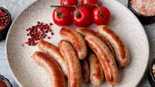 Grilled or barbecued chicken sausages for the dinner table. Grilled sausages