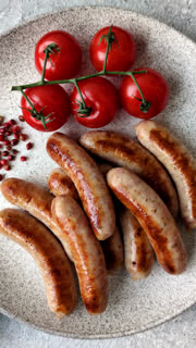 Grilled or barbecued chicken sausages for the dinner table. Grilled sausages