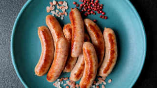 Grilled or barbecued chicken sausages for the dinner table. Grilled sausages