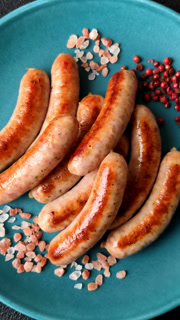 Grilled or barbecued chicken sausages for the dinner table. Grilled sausages