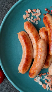 Grilled or barbecued chicken sausages for the dinner table. Grilled sausages