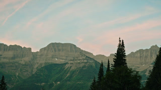 Glacier National Park Forest And Mountains with Vibrant Sunset Sky