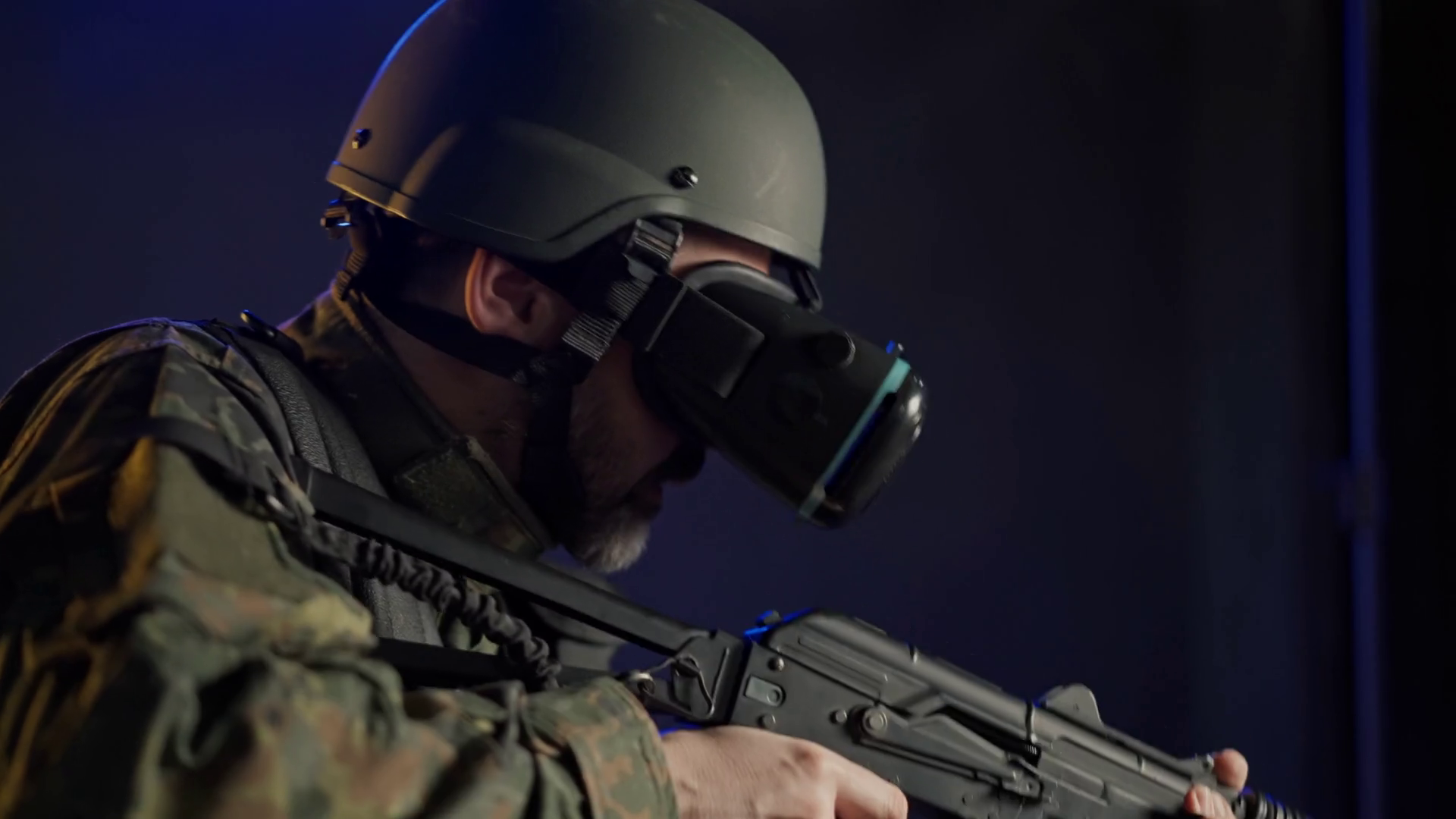 Soldier in military uniform using vr glasses for combat simulation