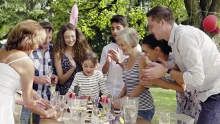 Family celebration or a garden party outside in the backyard.