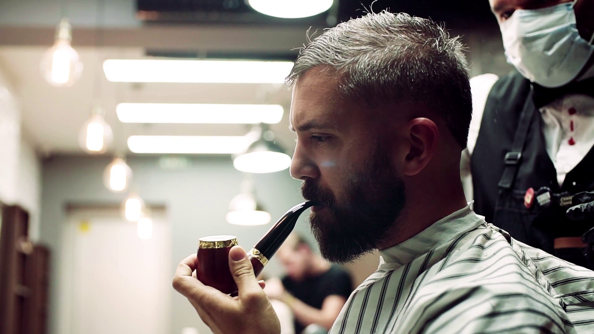 Handsome hipster man client visiting haidresser and hairstylist in