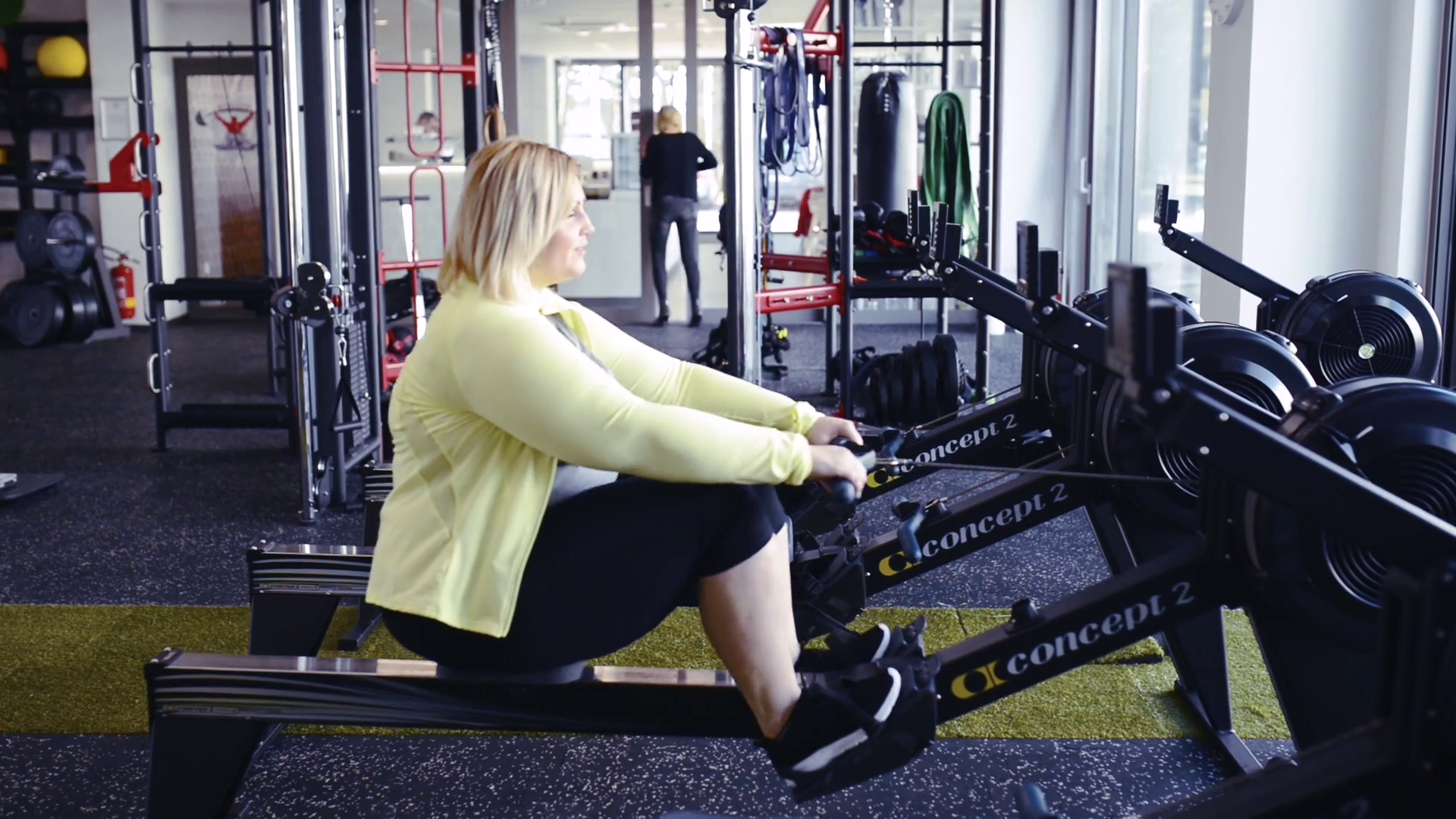 Overweight Woman In Gym Exercising On Rowing Stock Footage SBV