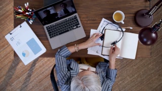 Top view of frustrated senior woman ending an online video call. Lockdown concept.