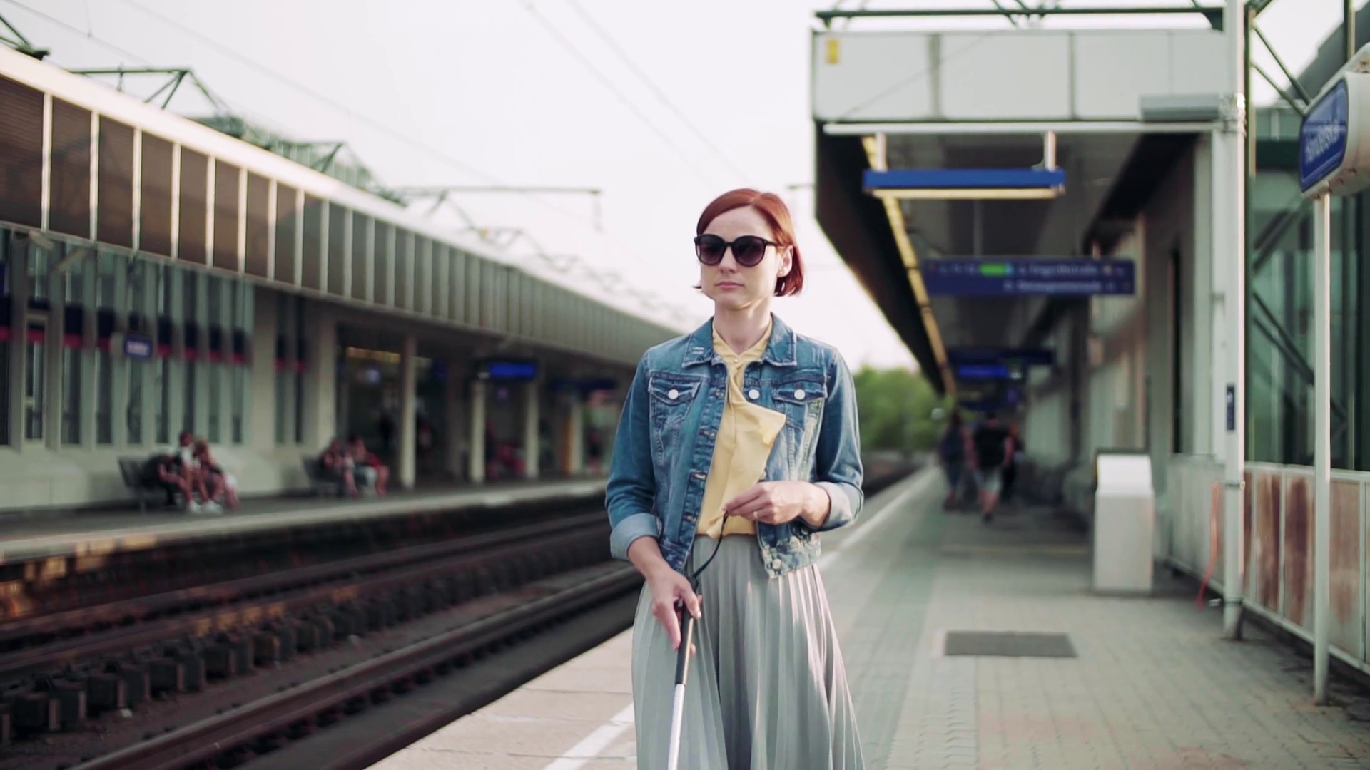 young blind woman commuter with white cane walking young blind woman commuter with white cane walking