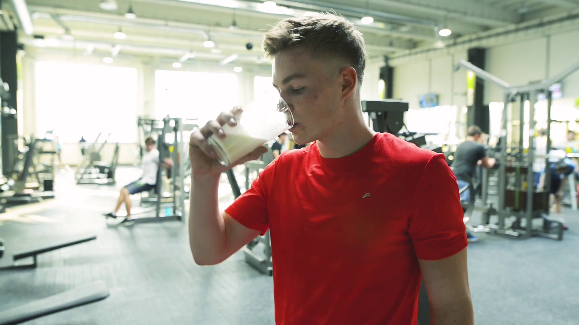 Young fit men in gym drinking protein shake. Stock Video Footage Storyblocks