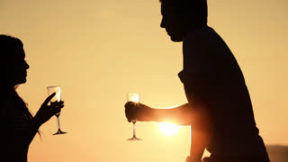 Couple kissing at sunset