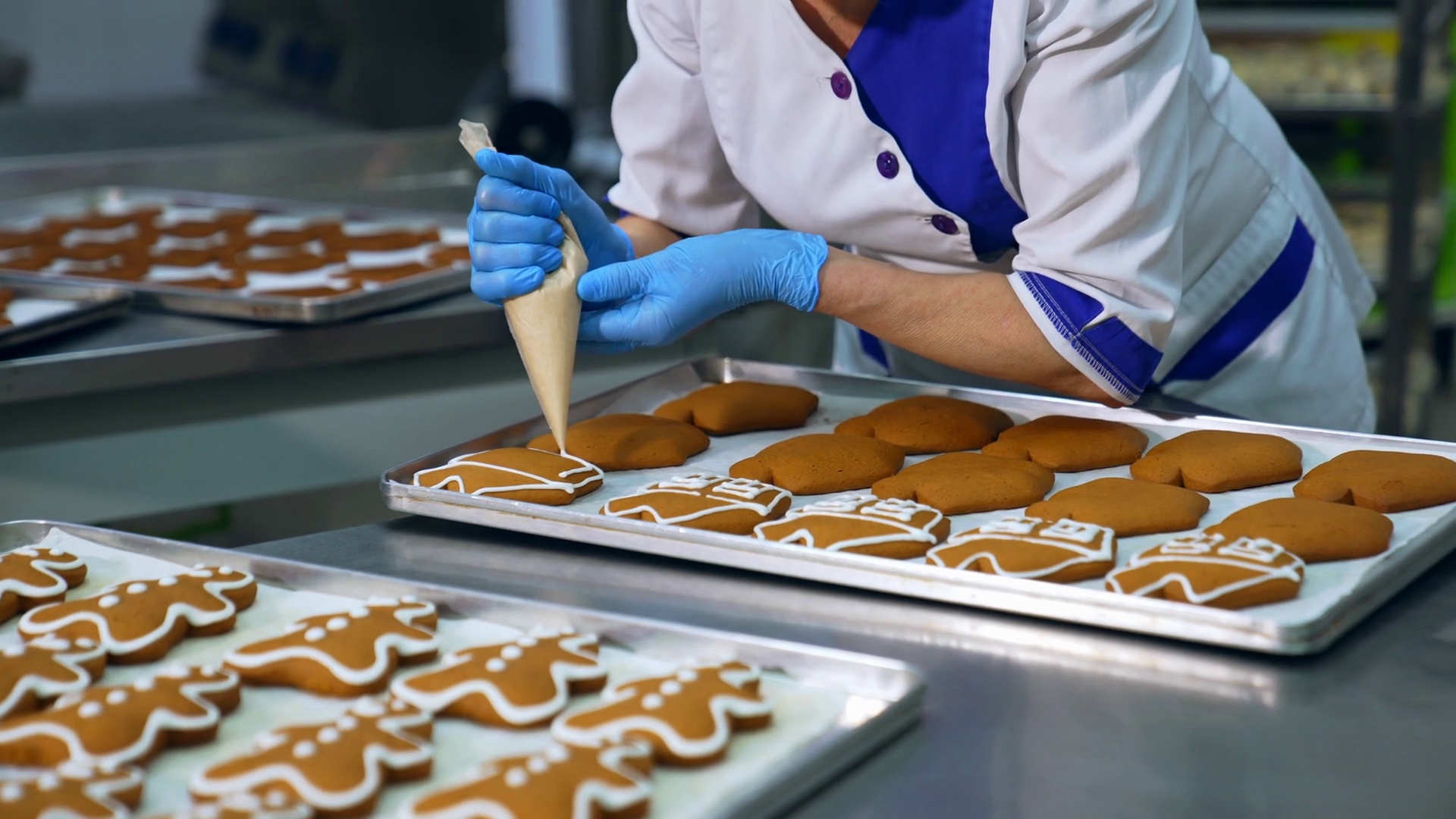 Worker Squeezing Icing Cover On Cookies From Stock Footage SBV ...