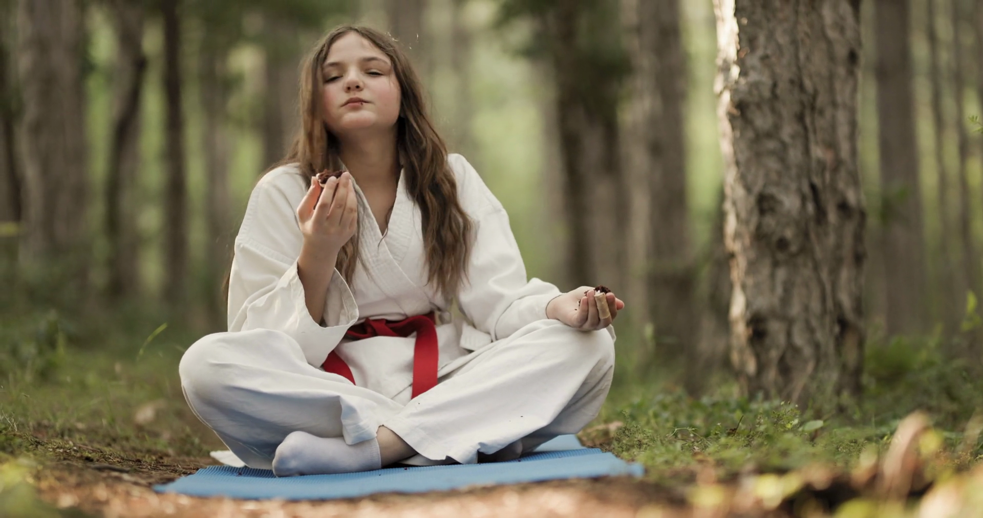 Young Girl In Karate Outfit Enjoys Snack In Stock Footage SBV-352936068 ...