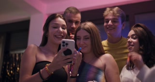 Friends Celebrate a Birthday with Drinks, Laughter, and Phone Photos