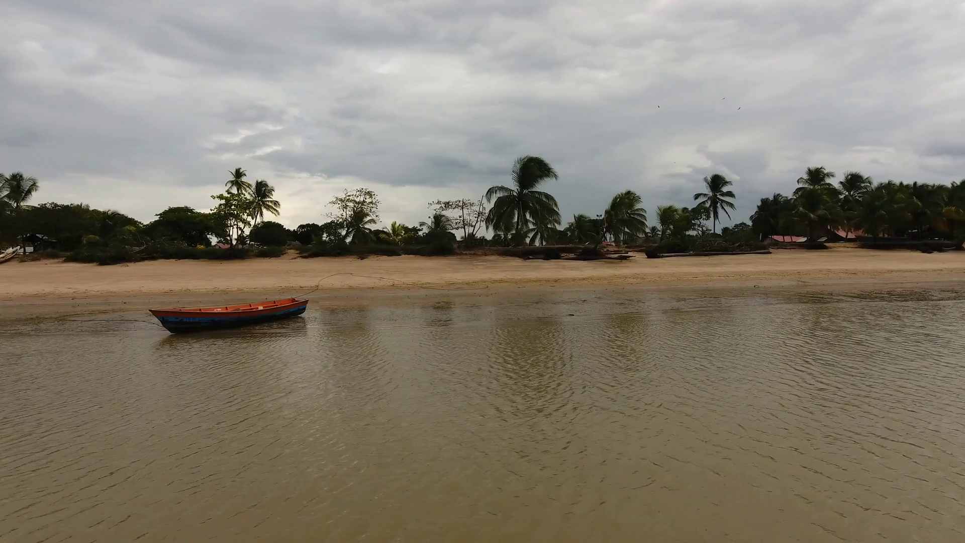 Aerial flight around a canoe on a beach Awala Yalimapo village Guiana