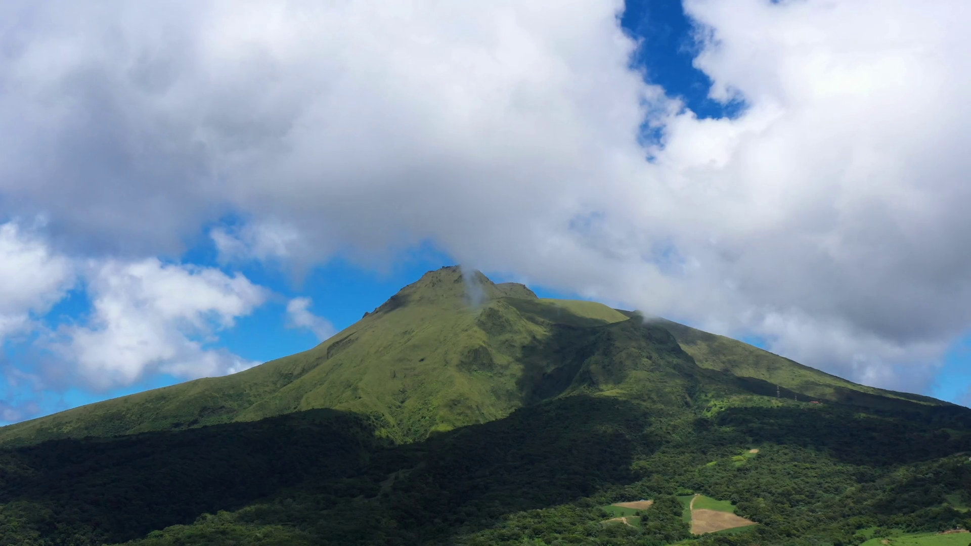 Highest mountain in Martinique volcano Pelee with clouds sunny day Stock Video Footage 0028 SBV