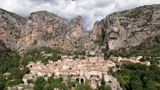 Scenic French Village Moustiers-Sainte-Marie Aerial Shot, Sunny Day