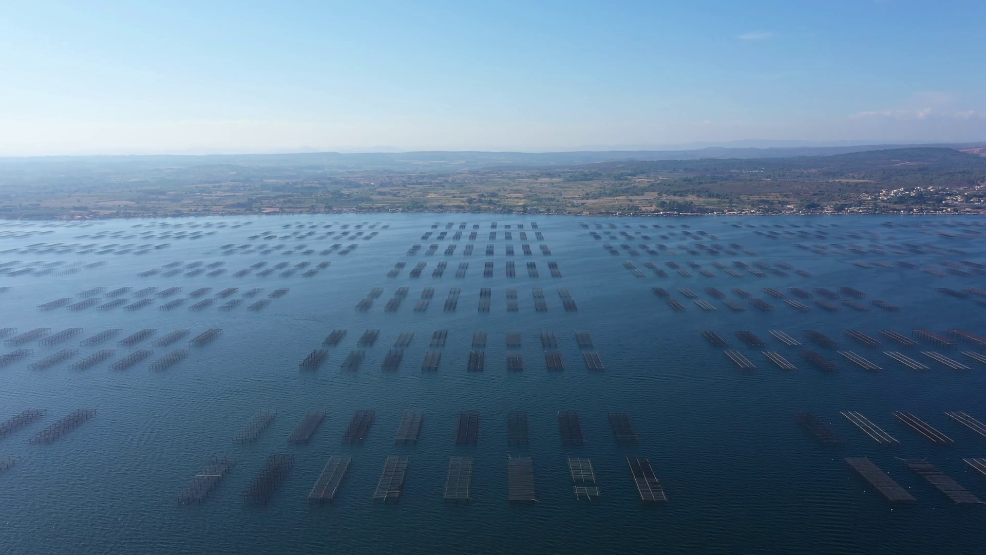 shellfish farming oysters farms Etang de Thau aerial view France sunny