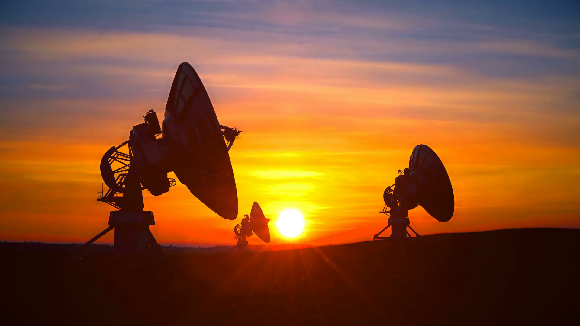 Three Radio Telescopes Against Scenic Sunset Stock Footage SBV