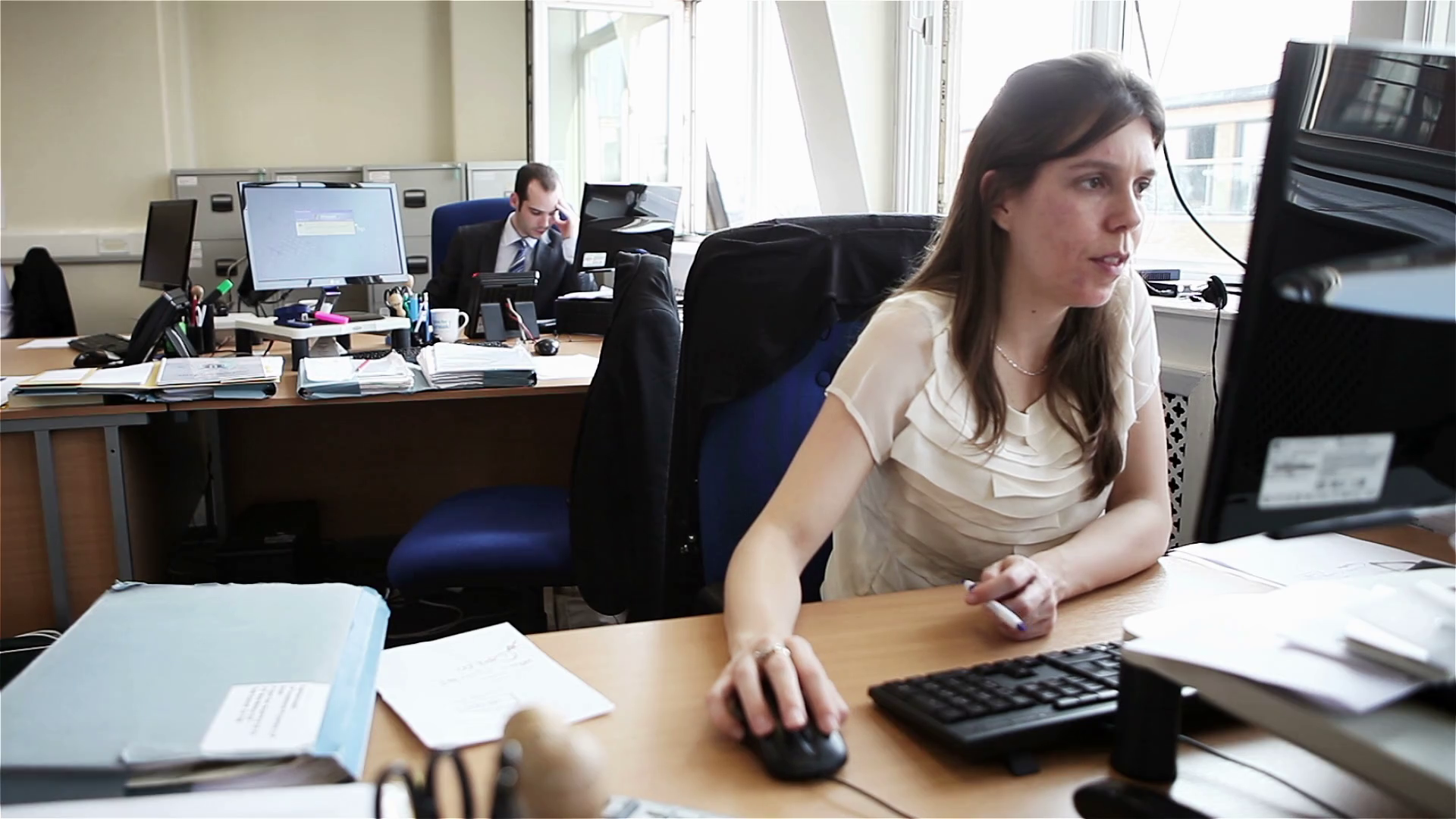 Candid video footage of a smartly dressed female office