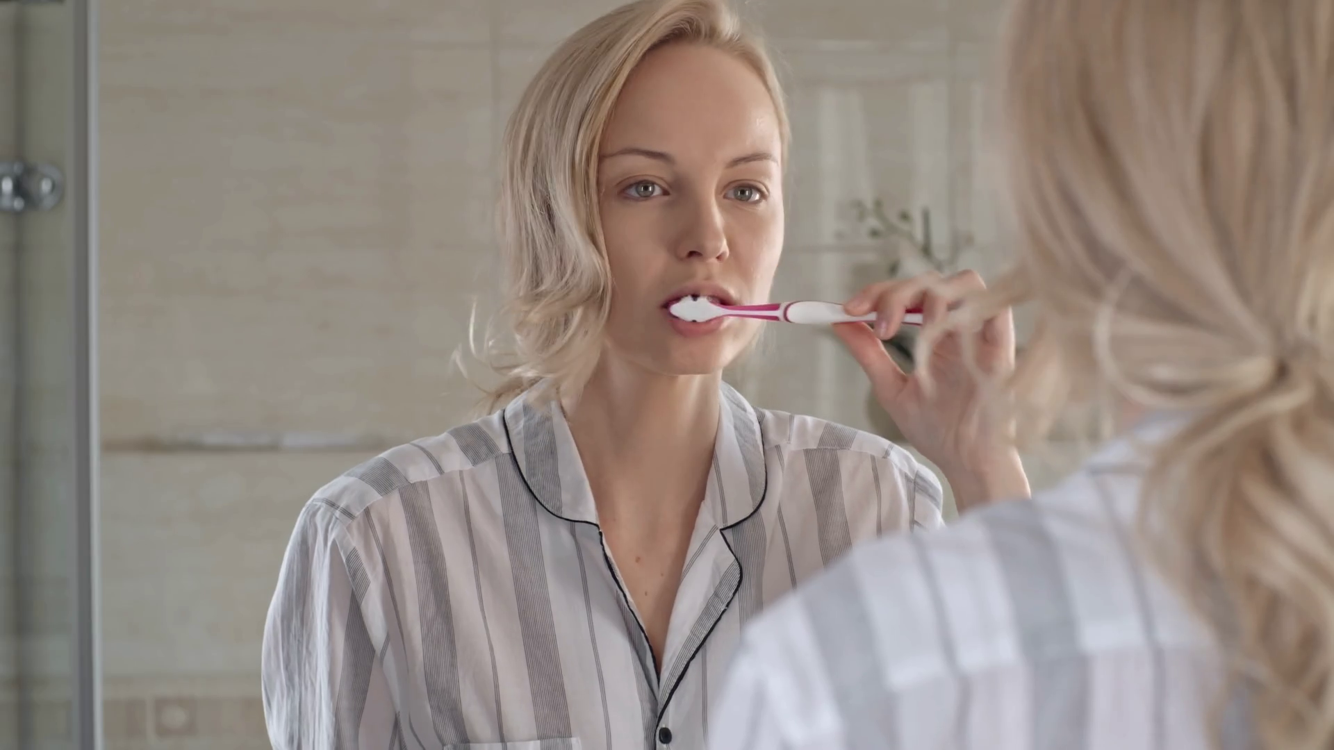 Woman Brushing Teeth In Front Of Mirror In Stock Footage SBV311191274