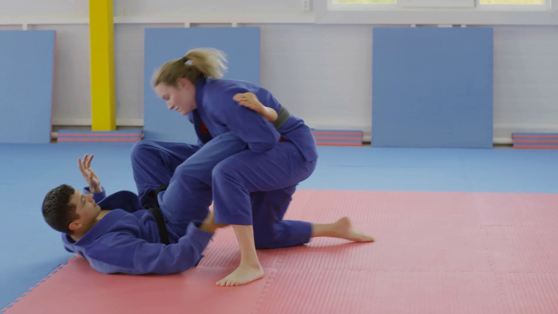 Barefoot Female Jiujitsu Athlete In Blue Stock Footage SBV338019347