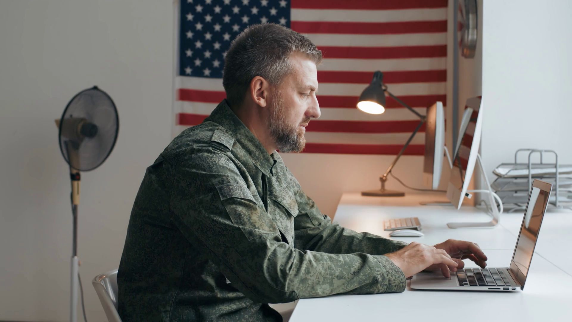 Slowmo side view shot of serious middleaged U.S. army officer in