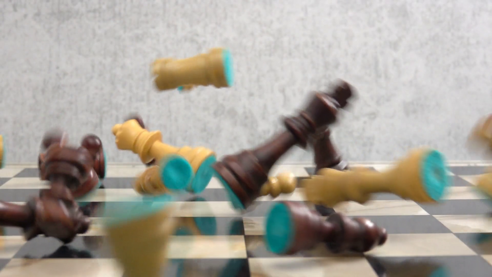 Chess pieces falling down on chessboard in slow motion. Concept of