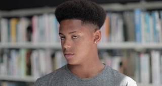 Portrait of african american male student in library