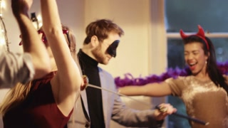 Young men and women dancing during Christmas party