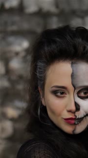 Witch and skeleton girls take a spooky selfie