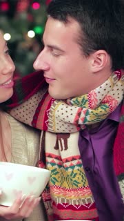 Intimate Christmas evening with a loving couple sharing warm moments