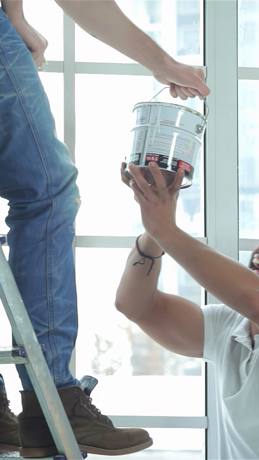 Dynamic Teamwork: Man On Ladder Hands Can Of Stock Footage SBV ...